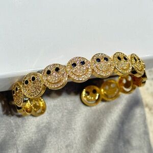 Gold Smiley Face Bracelet with Blue Sapphire Eyes